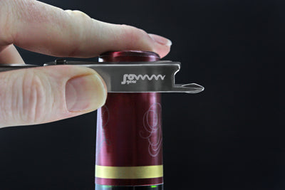 SommGear Vintage 1 wine key and bottle opener cutting the foil on a wine bottle.