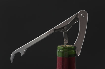 SommGear Vintage 1 wine key and bottle opener removing the cork of a wine bottle.